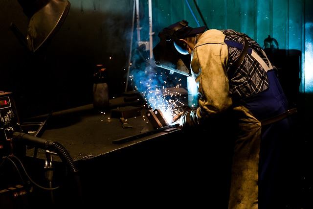 Welder working in a metal fabrication shop with bright sparks in Vaughan