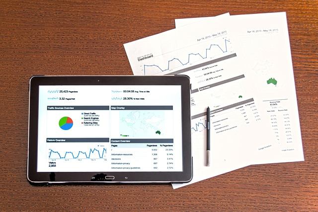 Printed analytics dashboard and reports on a desk, reviewing CerberusMSP client results