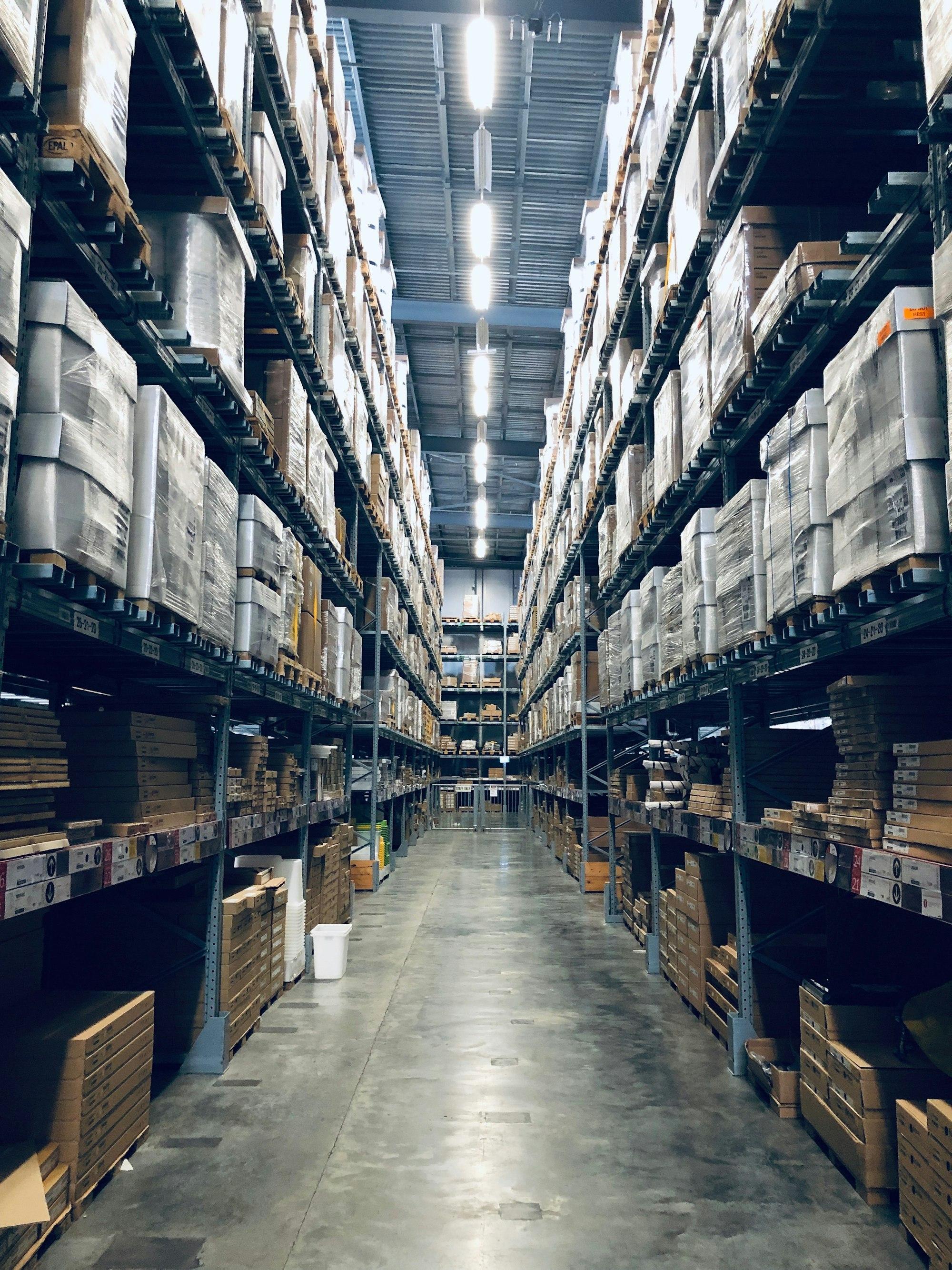 Rows of shelving stocked with pallets inside a Hamilton distribution warehouse