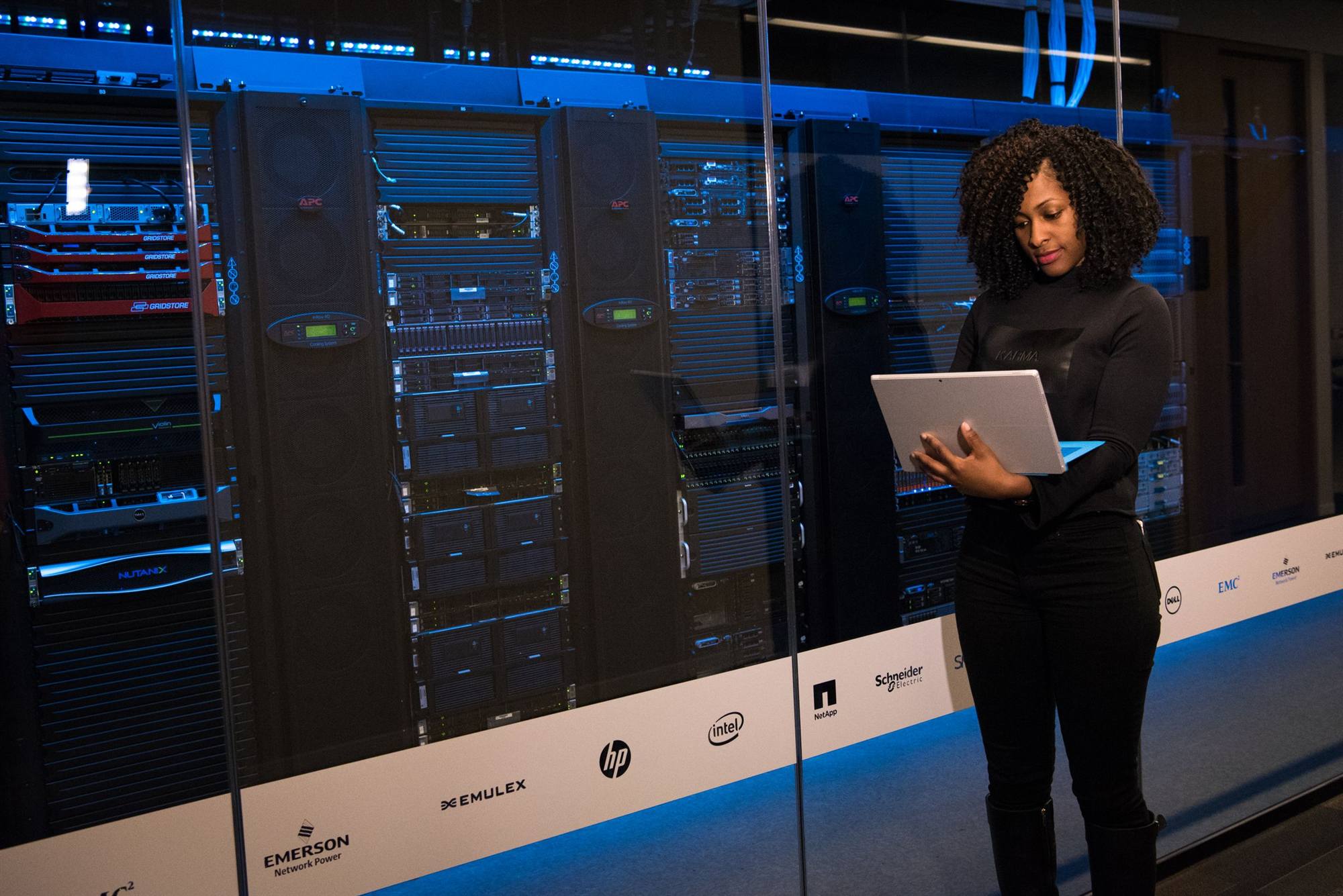IT professional reviewing cloud infrastructure in a data center