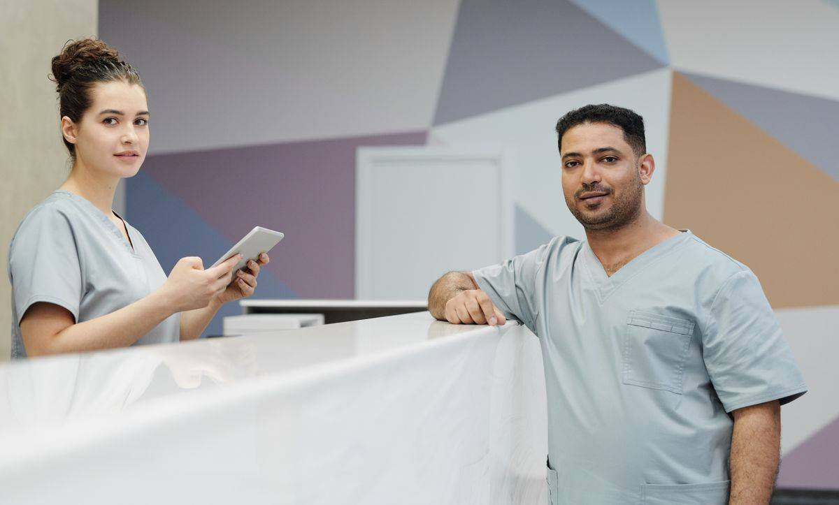 Medical clinic staff at a reception desk in Oakville, Ontario