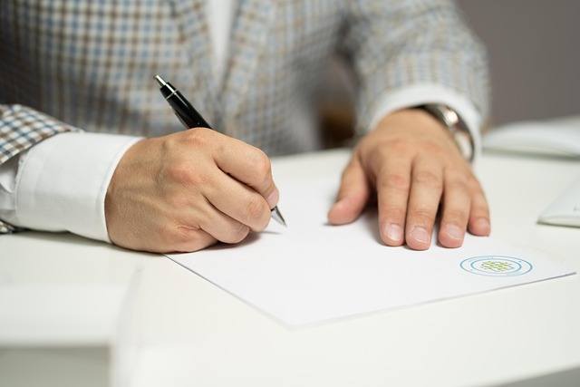 Hands signing a real estate legal document, secure IT support for law firms in Vaughan