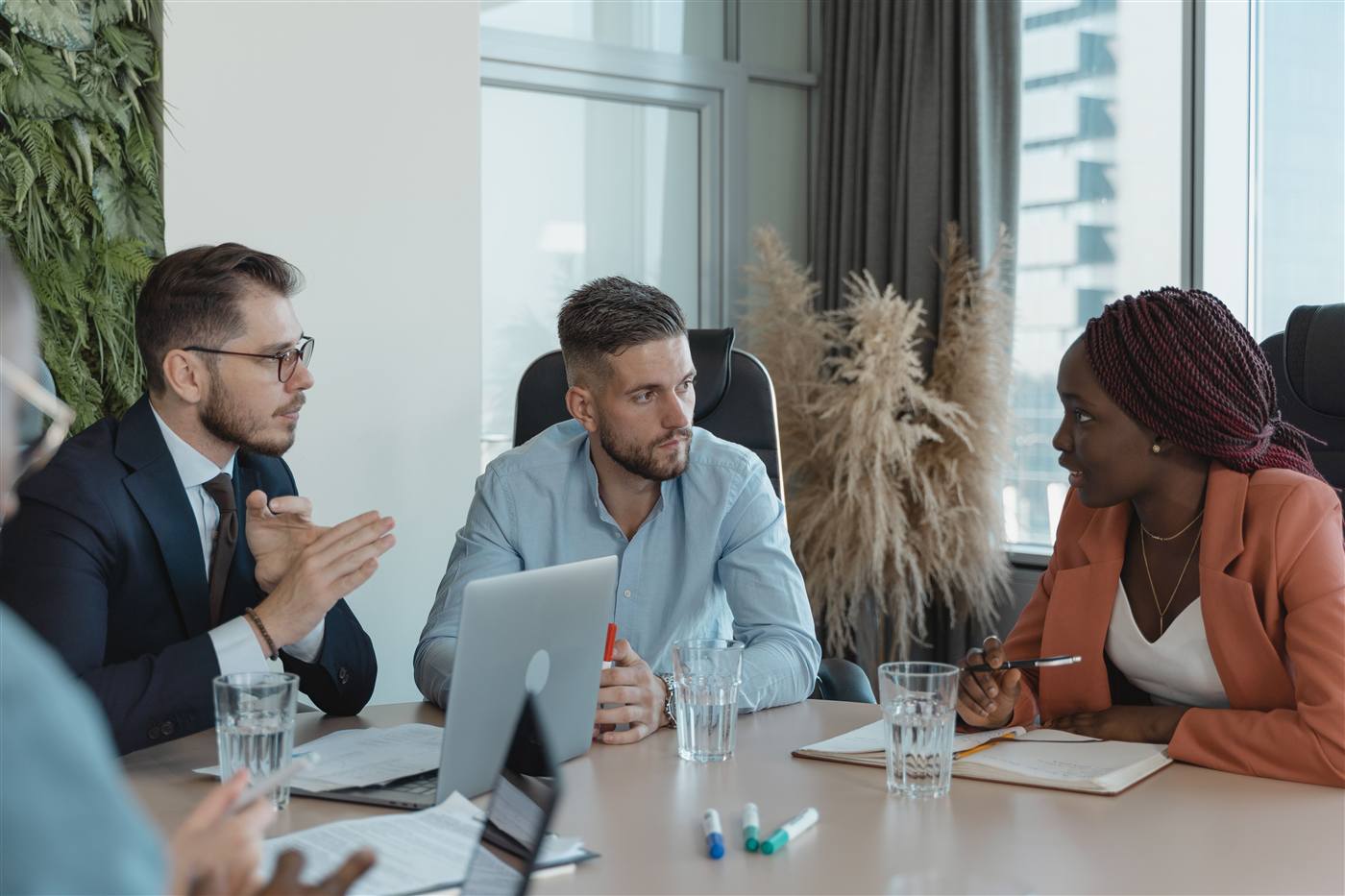Non-profit team meeting around a table, managed IT results for a Toronto non-profit
